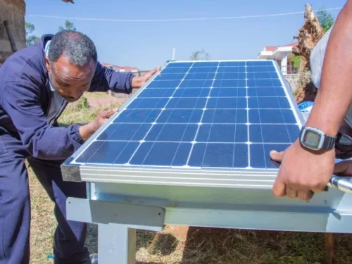 Man installing solar panel