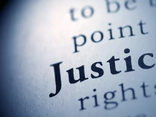 word justice in white circle